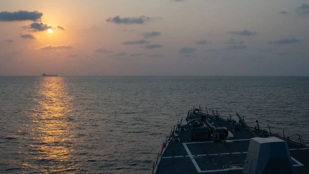 Guided-missile destroyer USS Pinckney (DDG 91) observes a merchant vessel while on patrol enforcing the U.S. blockade against Iran, May 4, 2026. Credit: U.S. Central Command.