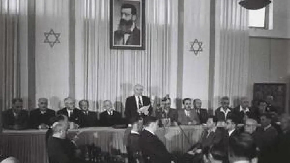 Israeli founding father and first prime minister David-Ben Gurion reading the declaration of the Independence of Israel in the Tel Aviv Museum, 1948. Credit: State of Israel National Photo Collection.