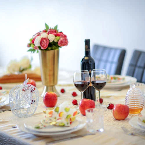 A dinner table set for the traditional Rosh Hashanah meal. Photo by Mendy Hachtman/Flash90.