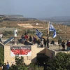 People at the illegal Jewish neighborhood of Netiv Ha’avot in Gush Etzion, ahead of the eviction of the neighborhood on June 12, 2018. Photo by Yonatan Sindel/Flash90.