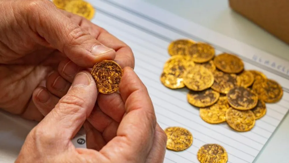 1,400-year-old gold coins found concealed in a wall at the Banias archeological site. Credit: Israel Antiquities Authority.