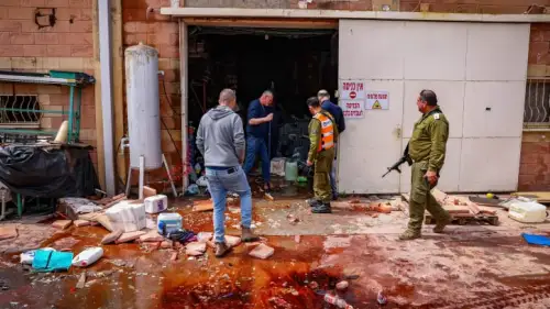Israeli security forces survey the damage in Kiryat Shmona following a hit by a rocket from Lebanon, March 27, 2024. Photo by David Cohen/Flash90
