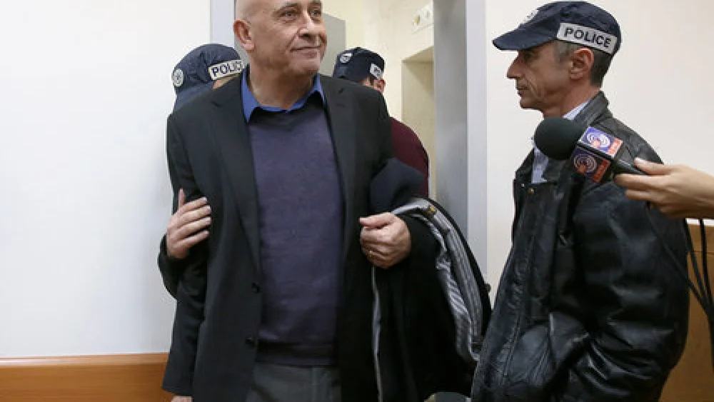 Basel Ghattas, an Arab member of the Israeli Knesset, is brought to the Rishon Lezion Magistrate's Court in central Israel Dec. 26, 2016, over allegations that he smuggled cell phones to Palestinian security prisoners. Credit: Koko/POOL/Flash90.
