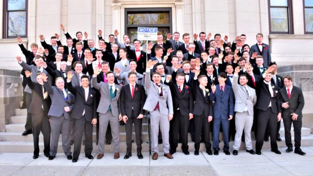 Male students from Baraboo High School in Baraboo, Wis., pose for junior prom photo doing the “Sig Heil” Nazi salute in 2017. The picture went viral on Nov. 12, 2018. Credit: Screenshot.