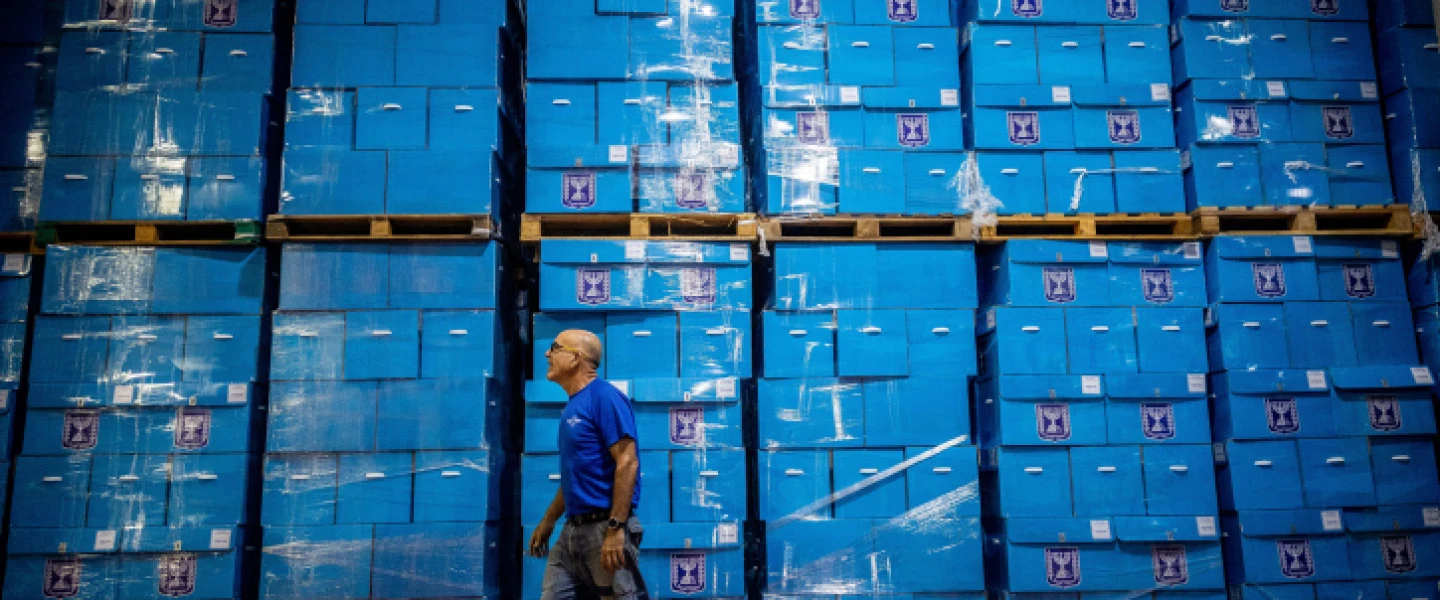 Workers prepare ballot boxes for the upcoming Israeli elections, at the central elections committee warehouse in Shoham, before they are shipped to polling stations, Oct. 12, 2022. Photo by Yonatan Sindel/Flash90.