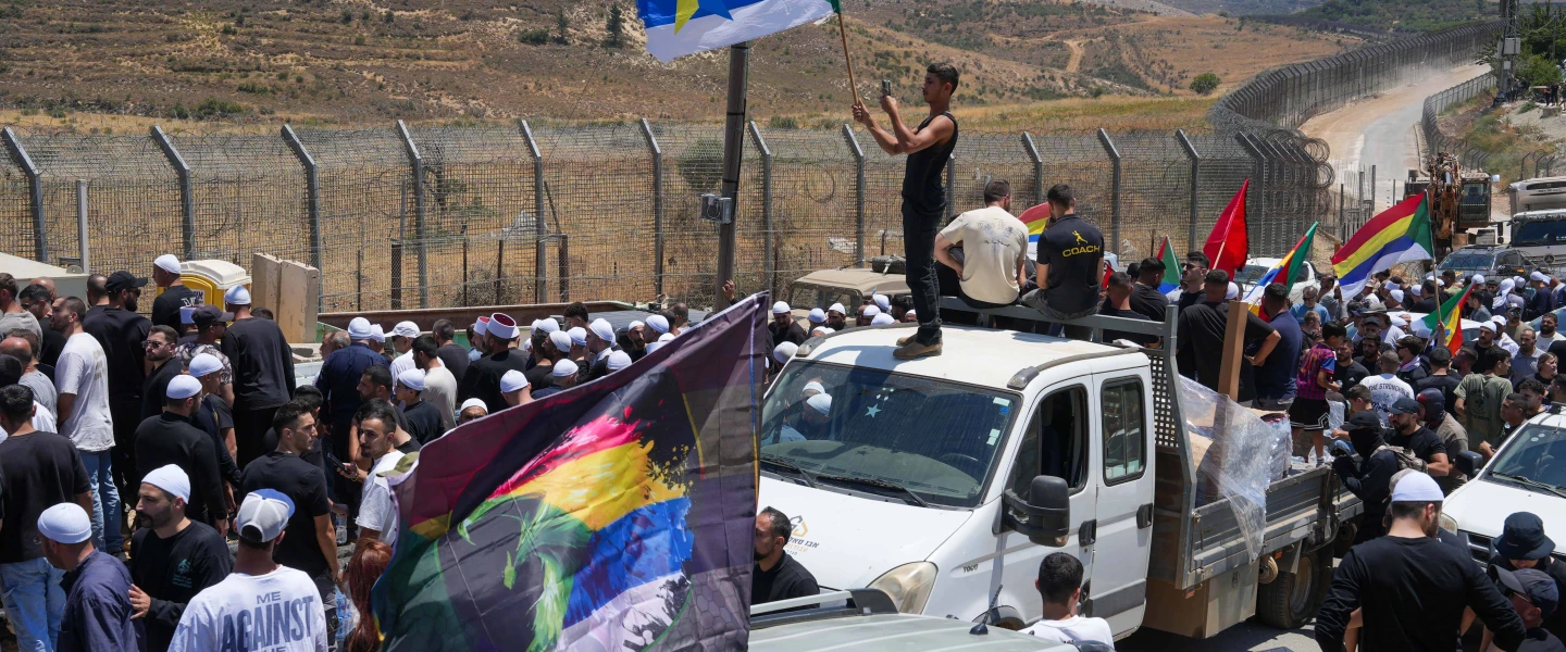 Druze residents protest near the Israeli-Syrian border fence in solidarity with their community in Syria, in Majdal Shams, July 16, 2025. Photo by Ayal Margolin/Flash90.