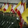 Hezbollah fighters march in a ceremony. Credit: Wikimedia Commons.