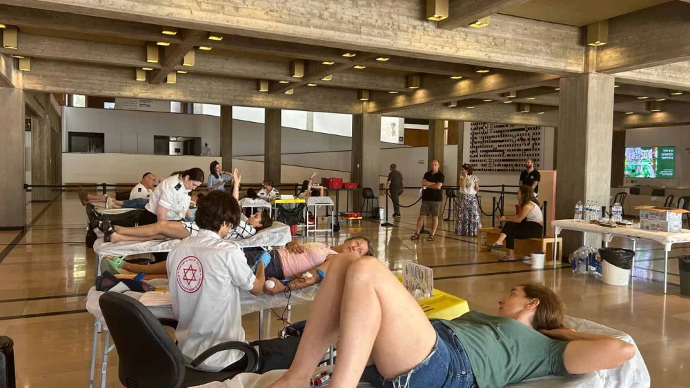 A blood donation event organized at "Hostage Square" in Tel Aviv in honor of Lior Rudaeff, who was killed by Hamas on Oct. 7 and whose body was kidnapped into Gaza, July 21, 2024. Photo by Amelie Botbol.