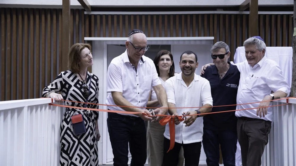 Timo Niemeijer cuts a ribbon at the re-dedicated synagogue of Ibim, Israel, on Oct. 11, 2026. Photo courtesy of Christians for Israel/JAFI.