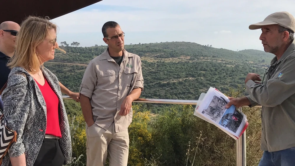 U.S. Forest Service Chief Vicki Christiansen is briefed by KKL-JNF staff at a memorial to those who perished during Israel's 2010 Carmel Fire, on May 26, 2019. Credit: Courtesy.