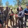Israel Police Commissioner Yaakov Shabtai (second from right) talks with members of the Israeli forces participating in the search for the terrorists who murdered three people in the city of Elad on May 5, 2022, in this image posted on social media on May 8, 2022. Source: Israel Police Twitter.