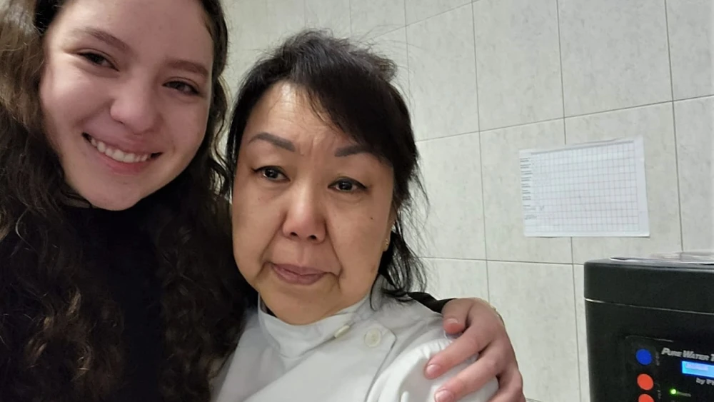 Shaina Moskovitz, daughter of Rabbi Moshe and Miriam Moskovitz, leaders of the Jewish community in Kharkiv, with a cook who helps at the synagogue, May 31, 2022. Credit: Courtesy.