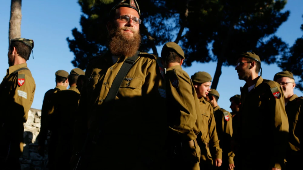 Religious soldiers attend their swearing-in ceremony as they join the Orthodox Netzah Yehuda Battalion (previously called the Nahal Haredi Battalion) at Ammunition Hill in Jerusalem on May 26, 2012. Photo by Miriam Alster/Flash90.