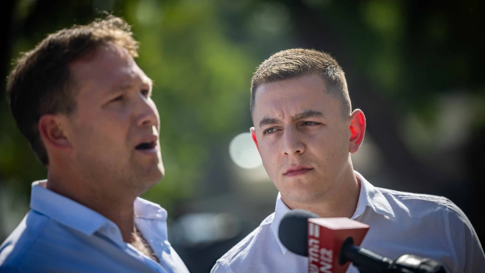 Golan Council Head Ori Kalner and Katzrin Mayor Yehuda Duah speak to the media after a meeting with Israeli Prime Minister Benjamin Netanyahu outside the Prime Minister's office in Jerusalem on August 22, 2024. Photo by Yonatan Sindel/Flash90.