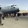 Afghanis run alongside a U.S. Air Force C-17 plane as it departs from Kabul, Afghanistan, on Aug. 16, 2021. Source: Screenshot.