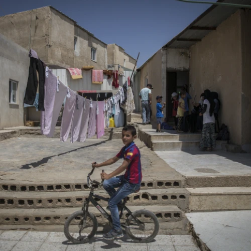 Bedouins seen outside their home in the village of Umm al Hiran in the Negev Desert on Aug. 27, 2015. It is one of about 46 unrecognized Bedouin villages in Israel. Photo by Hadas Parush/Flash90.