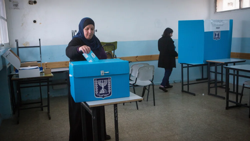 Arab Israelis cast their ballots at a polling station in the town of Beit Safafa during the elections for the 20th Knesset, March 17, 2015. Photo by Miriam Alster/Flash90.