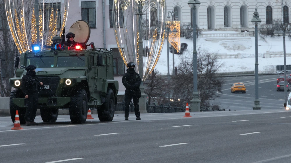 Armed officers of the Russian Federal Security Service patrol the bridge over the Moskva River opposite the Kremlin and the Chist The Saviour Cathedral in a Tiger armored vehicle, on Feb. 15, 2026, in Moscow, Russia. Photo by Contributor/Getty Images.