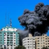 Smoke rising from the Al-Jalaa tower in Gaza City after an Israeli airstrike, which according to the Israel Defense Forces housed Hamas intelligence and weaponry. Several media outlets also had offices in the building, including the Associated Press and Al Jazeera. May 15, 2021. Photo by Atia Mohammed/Flash90.