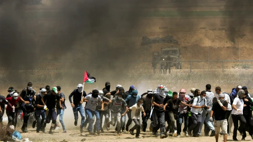 Palestinian protesters during clashes with Israeli forces at the Gaza border on May 11, 2018. Photo by Abed Rahim Khatib/Flash90