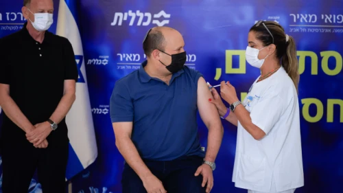 Israeli Prime Minister Naftali Bennett receives a third dose of the COVID-19 vaccine at the Meir Medical Center in Kfar Saba, on Aug. 20, 2021. Photo by Olivier Fitoussi/Flash90.