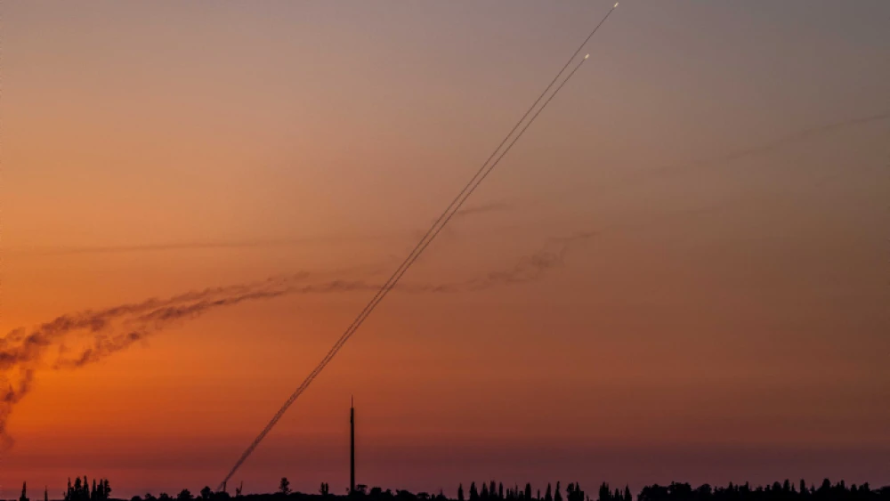 Terrorists fire a rocket from the Gaza Strip, as seen from Western Negev, Aug. 7, 2022. Photo by Yonatan Sindel/Flash90.