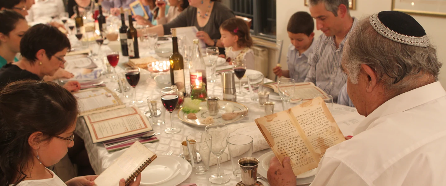 An Israeli family during the Passover seder on the first night of the holiday in Tzur Hadassah. Credit: Nati Shohat/Flash90.