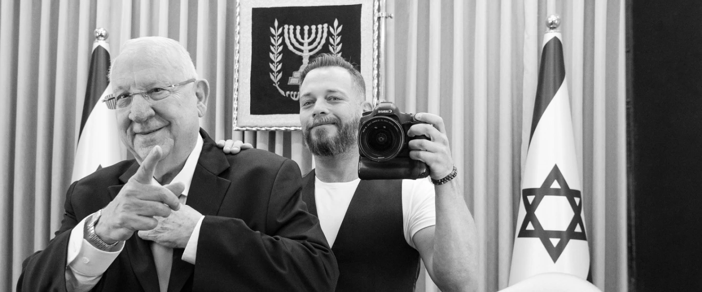 Israeli combat veteran and photographer Lior Nir poses with former Israeli President Reuven Rivlin as part of a pop-up exhibition showing this weekend in New York City to raise awareness of Israeli vets dealing with PTSD. Credit: Mike Wagenheim.