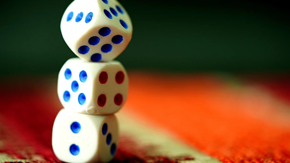Game board dice. Credit: ignartonosbg/Pixabay.
