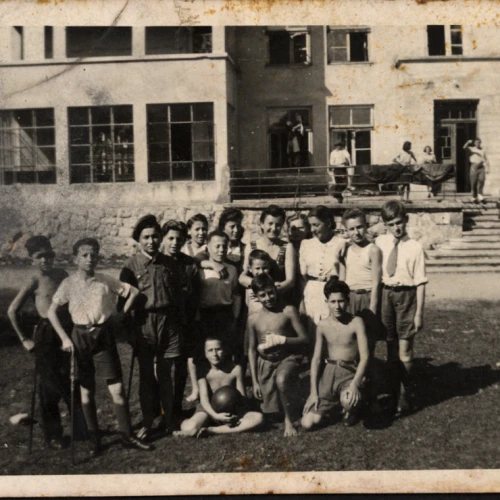 Lena Küchler (center), director of the children's home in Zakopane, Poland, with the children and staff in 1945. Credit: Yad Vashem.