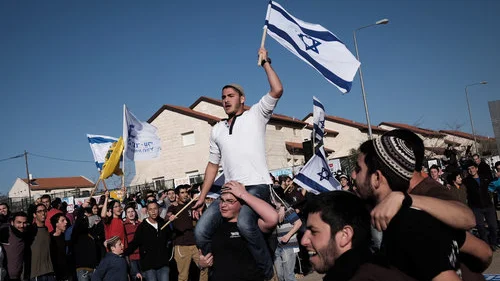 A demonstration against the planned demolition of nine homes in the Israeli settlement of Ofra, Feb. 5, 2017. Credit: Tomer Neuberg/Flash90.