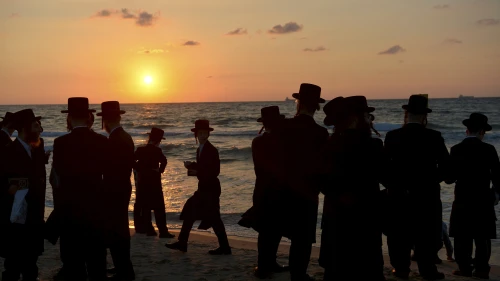 Chassidic men pray on the beach on Sept. 17, 2018 in the southern Israeli city of Ashdod as part of the High Holiday ritual of Tashlich, where believers symbolically cast off their sins into the water. Typically done on Rosh Hashanah, the tradition can take place up until Hoshanah Rabbah, the seventh day of the Jewish holiday of Sukkot. Photo by Yossi Zeliger/Flash90.