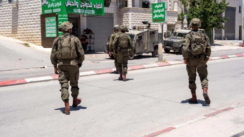 Israeli troops arrest a Palestinian terrorist in Awarta, near Nablus (Shechem) in central Samaria, May 16, 2024. Credit: IDF.