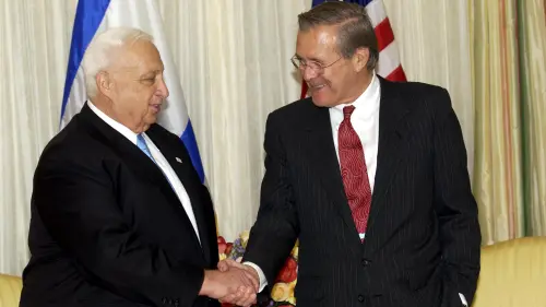 Former U.S. Defense Secretary Donald Rumsfeld with Israeli Prime Minister Ariel Sharon in October 2002. Credit: Avi Ohayon/GPO.