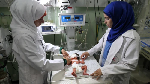 Palestinian nurse examined a baby at the Amarati Hospital in Rafah, south of the Gaza Strip, June 27, 2017. Photo by Abed Rahim Khatib/ Flash90