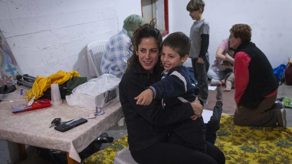 Israelis take cover at bomb shelter in Jerusalem as a siren sounds warning of incoming ballistic missiles fired from Iran toward Israel, March 11, 2026. Photo by Yonatan Sindel/Flash90.