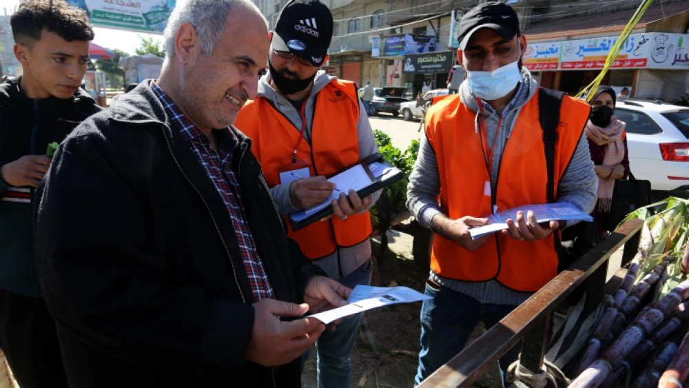 Palestinian Central Election Commission workers register citizens in Rafah, in the southern Gaza Strip, in preparation for the May elections, Feb. 10, 2021. Photo by Abed Rahim Khatib/Flash90.