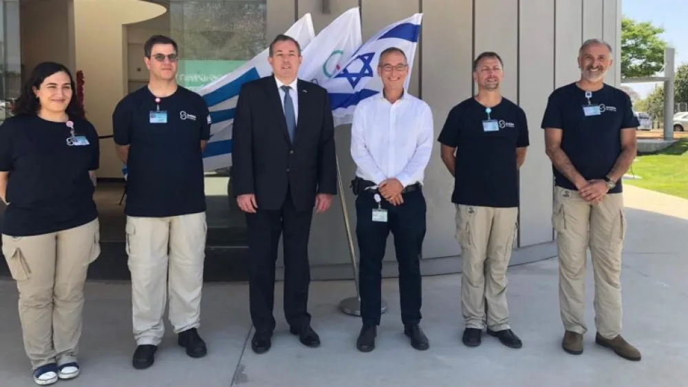 Uruguay's Ambassador to Israel Bernardo Griever (in suit) wishes the Sheba Medical Center team traveling to his home country a successful journey. Alongside him is Prof. Arnon Afek, the deputy director general of the hospital. Photo courtesy of Sheba Medical Center.