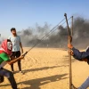 Palestinian protesters during clashes with Israeli forces near the Gaza-Israel border in the Gaza Strip, in Khan Yunis on June 1, 2018. Photo by Abed Rahim Khatib/Flash90.