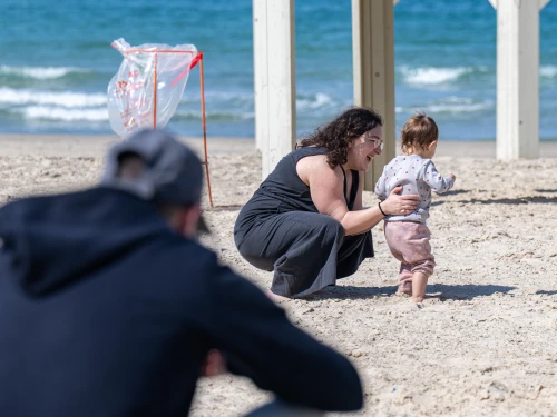 People on Beach Between Sirens