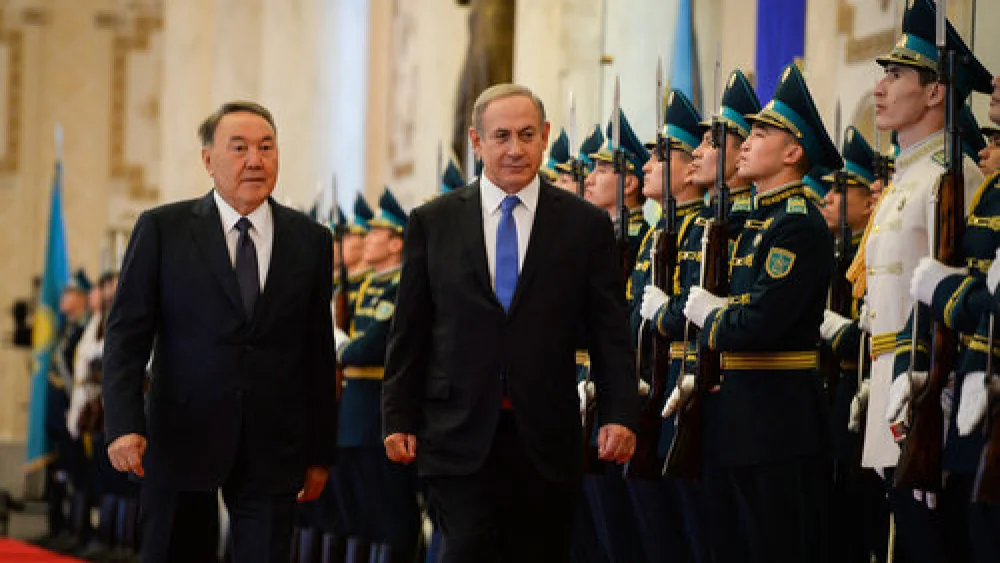 Israeli Prime Minister Benjamin Netanyahu (center) and Kazakh President Nursultan Nazarbayev (left) are welcomed at Kazakhstan’s President's Palace Dec. 14, 2016. Credit: Haim Zach/GPO.