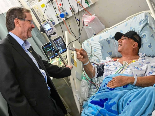 Israeli President Isaac Herzog visits a patient at Tel Aviv Sourasky Medical Center's Ichilov Hospital, March 2026. Credit: Israeli President's Residence.