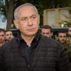 Israeli Prime Minister Benjamin Netanyahu speaks with Israeli soldiers during his visit at the Northern Command base in Tzfat on Dec. 11, 2018. Photo by Basel Awidat/Flash90.