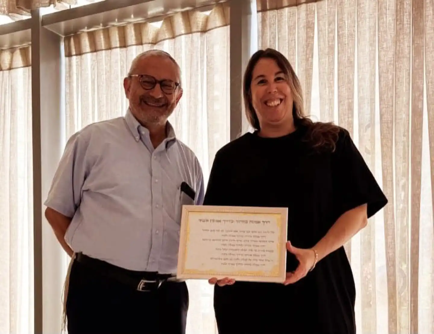 Rabbi Zev Shandalov with Meirav Berger, mother of former Gaza hostage Agam Berger, on Aug. 4, 2026. Credit: Courtesy.