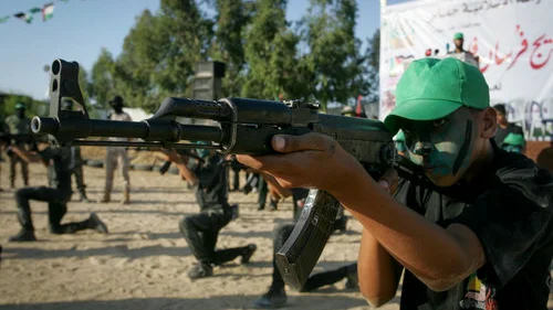 Palestinian youths participate in a graduation ceremony of a military-style camp organized by the Hamas terror group in Gaza on Aug. 18, 2017. Credit: Abed Rahim Khatib/Flash90.
