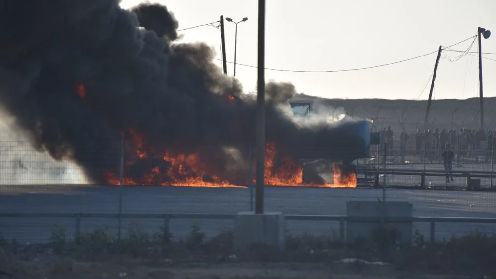 Palestinians set fire to the Kerem Shalom Crossing on May 14, 2018. Credit: IDF Spokespersons Unit.