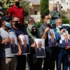 Palestinians hold photo printouts during a rally in support of Palestinian Authority leader Mahmoud Abbas in the West Bank town of Tubas on Sept. 27, 2020. Photo by Nasser Ishtayeh/Flash90.