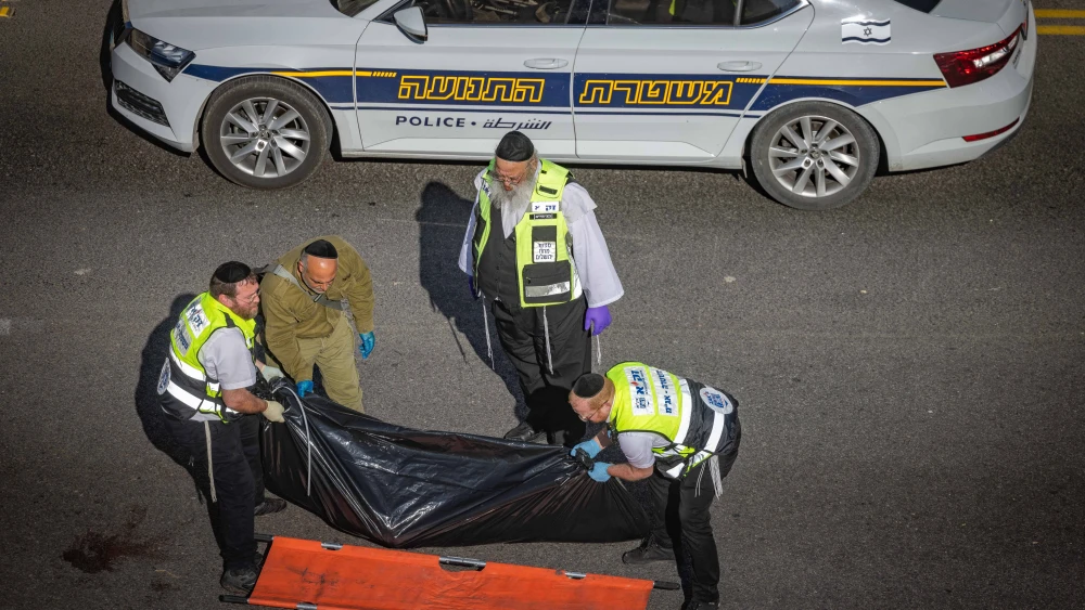 Security and rescue personnel at the scene of a terrorist attack on Route 1 near Ma'ale Adumim, on Feb. 22, 2024. Photo by Chaim Goldberg/Flash90.