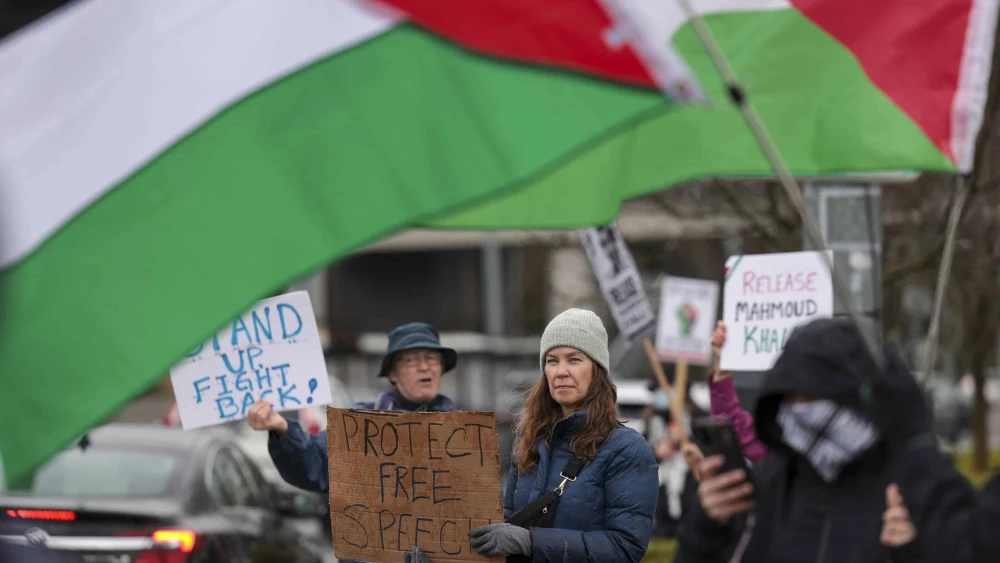 People hold signs as they protest the arrest of former Columbia University student activist Mahmoud Khalil and show support for Palestinians during a “Fight for Our Rights” demonstration by Shut It Down for Palestine (SID4P) and various local groups at the University of Washington campus in Seattle on March 15, 2025. Photo by Jason Redmond/AFP via Getty Images.