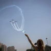Watching the military airshow during Israel's 70th Independence Day celebrations in Jerusalem on April 19, 2018. Credit: Yonatan Sindel/Flash90.